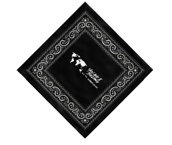 Flat and angled product views of a black bandana featuring a white paisley border and a white You and I Belong world map logo in the center.