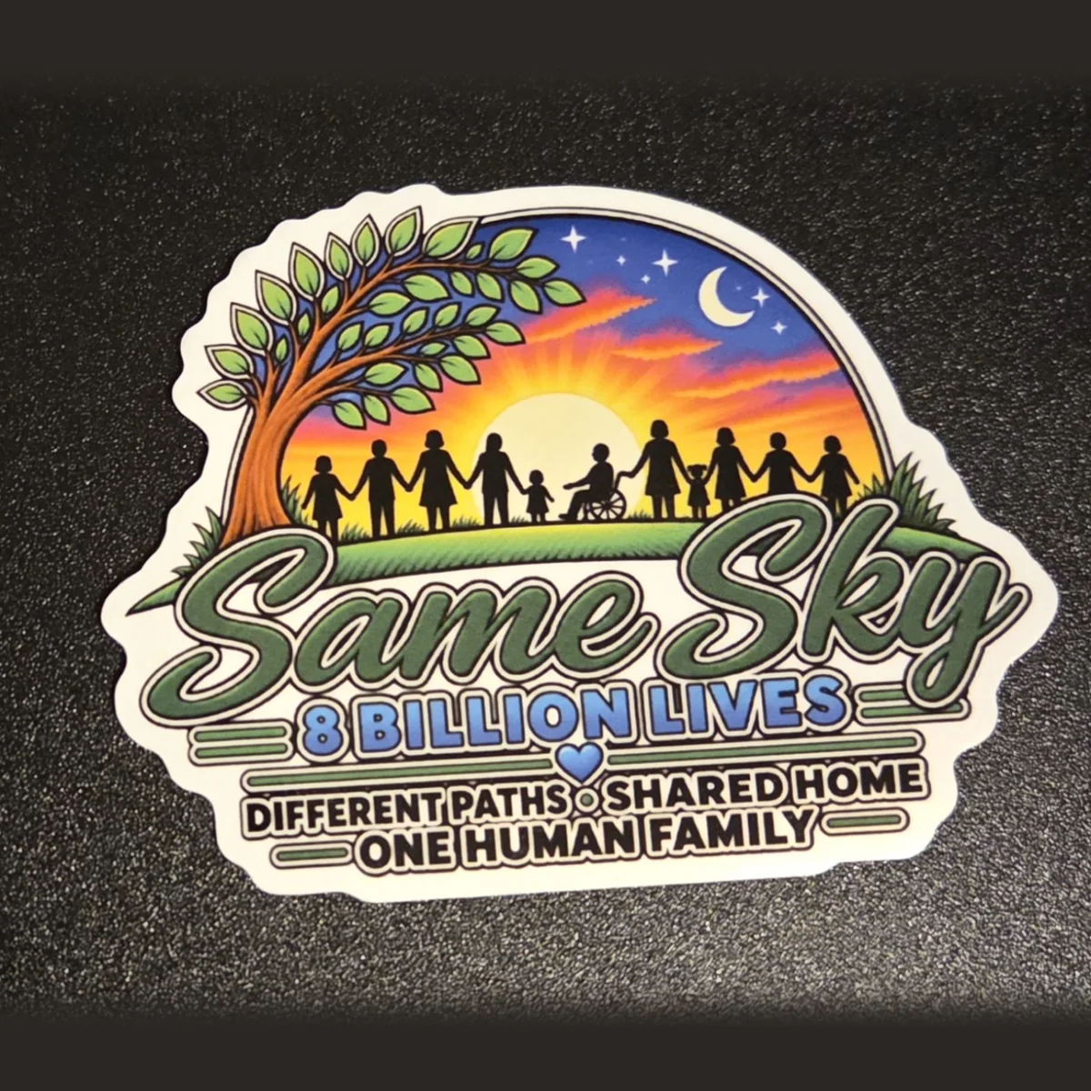 Same Sky 8 Billion Lives sticker: silhouettes of people holding hands at sunset beneath a tree, with the words Different paths, shared home, one human family